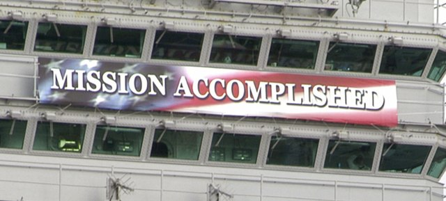 "Mission Accomplished" banner hanging on the USS Abraham Lincoln on May 1, 2003.